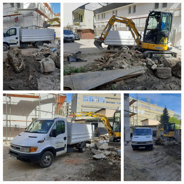 Odvoz otpada bagerom i uskim kamionom u centru grada